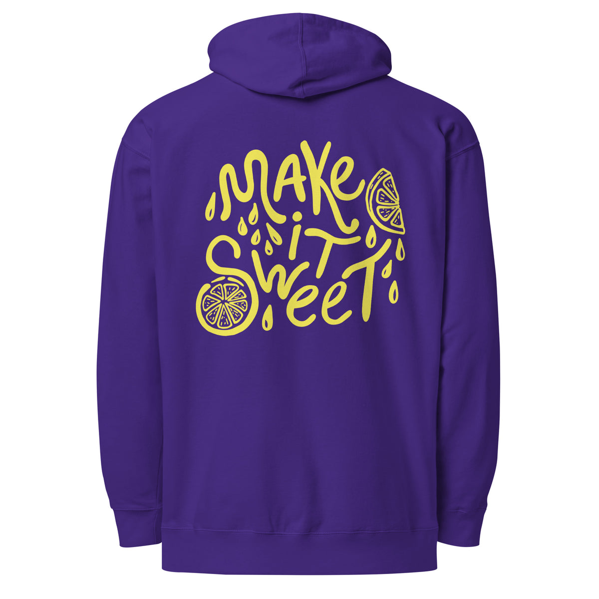 A purple pullover hoodie shown from the back, featuring a large yellow graphic print that reads 'MAKE IT SWEET' in a stylized font with lemon slice illustrations and droplet details.